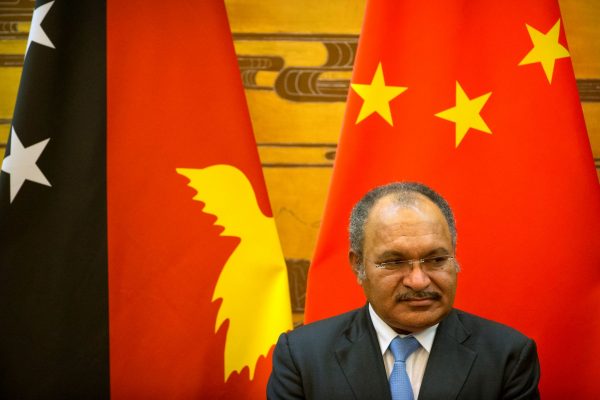 Papua New Guinea's Prime Minister Peter O'Neill watches a signing ceremony at the Great Hall of the People in Beijing, China, 6 July 2016 (Photo: Reuters/Mark Schiefelbein).