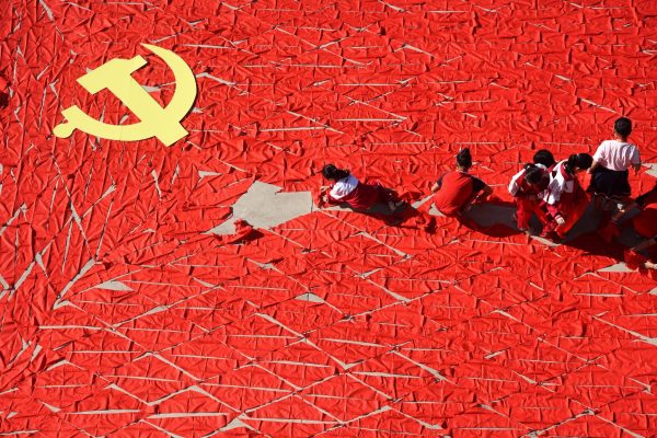 Students use red scarves to make a flag of the Communist Party of China, ahead of the 19th National Congress of the Communist Party, at a primary school in Linyi, Shandong province, China, 13 September 2017 (Photo: Reuters/Stringer).