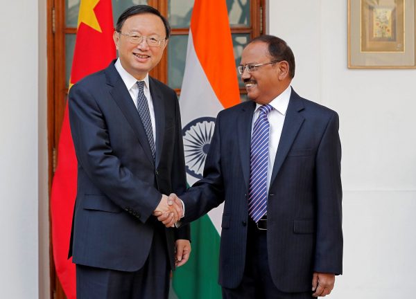 China's State Councillor Yang Jiechi and India's National Security Advisor Ajit Doval shake hands during a photo opportunity before their meeting in New Delhi, India, 22 December 2017 (Photo: Reuters/Hussain).
