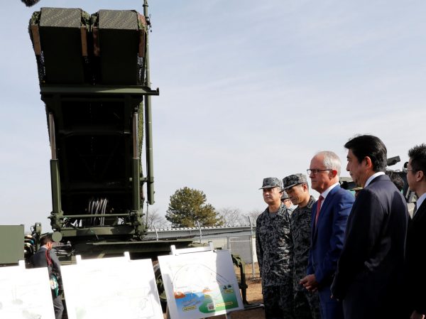 Australian Prime Minister Malcolm Turnbull and Japanese Prime Minister Shinzo Abe listen to an explanation in front of an MIM-104 Patriot PAC-3 missile interceptor at Camp Narashino in Funabashi, east of Tokyo, Japan, 18 January 2018 (Photo: Reuters/Kim Kyung-Hoon).