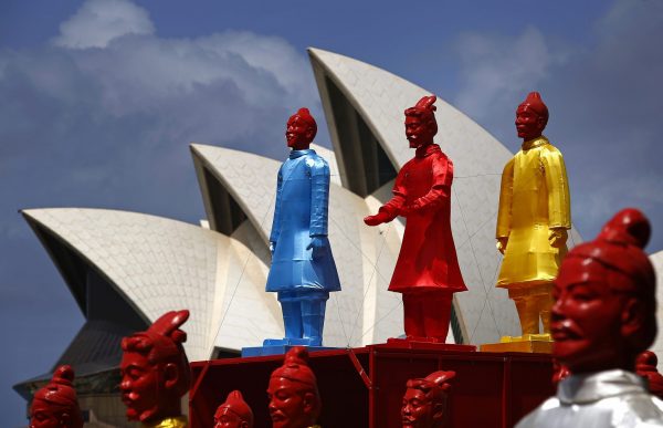 An art installation called the 'Lanterns of the Terracotta Warriors' stands in front of the Sydney Opera House 19 February 2015. The more than two-meter (7 feet) high lanterns, shaped in the form of China's famous terracotta warriors that were unearthed in 1974, are on display as part of Sydney's Chinese Lunar New Year Festival. (Photo: Reuters/David Gray).