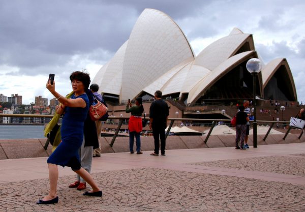 A Chinese tourist takes a selfie at the Sydney Opera House in March 2017: closer ties with China carry economic benefits for Australia (Photo: Reuters/David Gray).