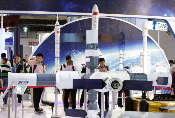People visit the booth of China Aerospace Science and Technology Corporation at China Beijing International High-tech Expo in Beijing, China 8 June 2017 (Photo: Reuters/Jason Lee).