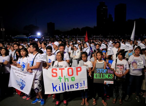 Participants display placards as they participate in a procession against plans to reimpose the death penalty and to intensify the drug war during 'Walk for Life' in Luneta park, Metro Manila, Philippines, 24 February 2018 (Photo: Reuters/Romeo Ranoco).