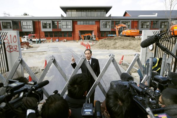 Yasunori Kagoike, administrator of Moritomo Gakuen, the academic organisation linked to a land sale controversy that has engulfed Prime Minister Shinzo Abe and his wife Akie, speaks to media at an elementary school of the organization under construction in Toyonaka, Osaka prefecture, Japan, on 9 March 2017. (Photo: Reuters/Kyodo).