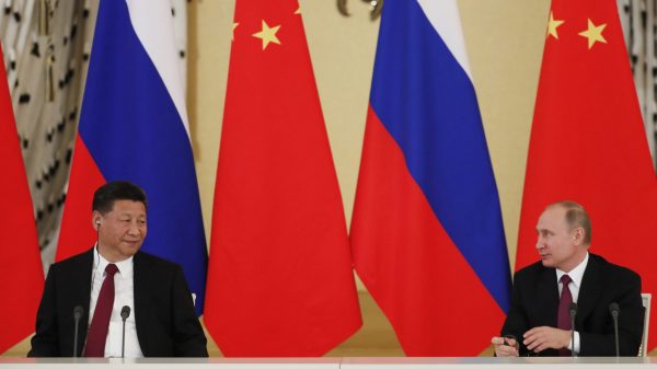 Russian President Vladimir Putin and his Chinese counterpart Xi Jinping attend a meeting with representatives of civic organisations, business and media communities at the Kremlin in Moscow, Russia, 4 July 2017 (Photo: Reuters/Sergei Ilnitsky/Pool).
