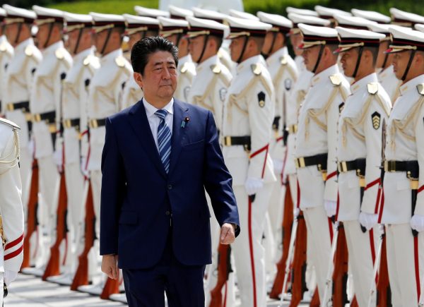 Japan's Prime Minister Shinzo Abe reviews the honour guard before a meeting with Japan Self-Defense Force's senior members at the Defense Ministry in Tokyo, Japan, 11 September 2017 (Photo: Reuters/Toru Hanai).