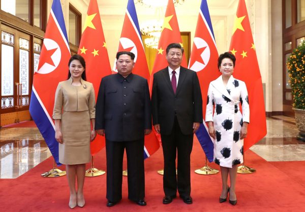 North Korean leader Kim Jong Un and wife Ri Sol Ju pose for a picture with Chinese President Xi Jinping and wife Peng Liyuan at the Great Hall of the People in Beijing, China, 28 March 2018 (Photo: Reuters/Ju Peng/Xinhua).
