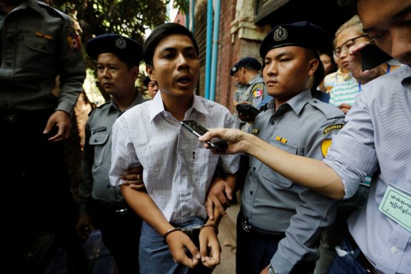Detained Reuters journalist Kyaw Soe Oo speaks to the media after a court hearing in Yangon, Myanmar, 4 April 2018 (Photo: Reuters/Ann Wang).