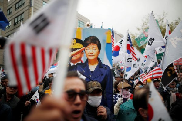 Supporters of ousted President Park Geun-hye gather outside a court after a South Korean court jailed her for 24 years, in Seoul, South Korea, 6 April 2018 (Photo: Reuters/Kim Hong-Ji).