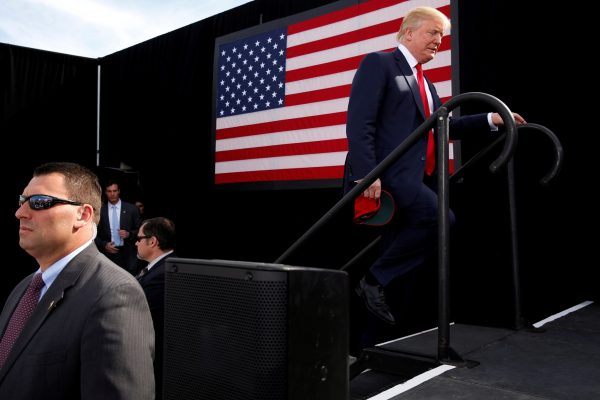 Donald Trump takes the stage for a rally at a car dealership in Portsmouth, New Hampshire, US, 15 October 2016 (Photo: Reuters/Jonathan Ernst).