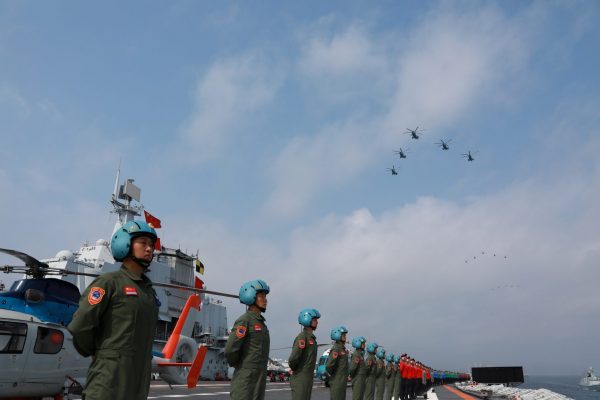 Navy personnel of the Chinese People's Liberation Army (PLA) Navy take part in a military display in the South China Sea on 12 April 2018. (Photo: Reuters/Stringer).