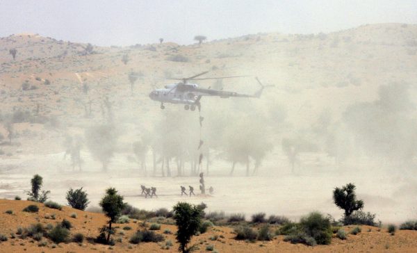 Indian army soldiers take part in an army exercise near Pallu in India's desert state of Rajasthan, 2 May 2007. The exercise involved fighter planes and helicopters besides tanks, mechanised infantry, medium and field artillery, air defence and elements of signals and engineering units, local media reported (Photo: Reuters/B Mathur).