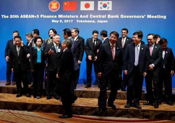 Ministers and central bank governors including Bank of Japan Governor Haruhiko Kuroda, Chinese Vice-Minister of Finance Shi Yaobin leave from podium after a photo session at ASEAN+3 Finance Ministers and Central Bank Governors' Meeting on the sideline of Asian Development Bank (ADB)'s annual meeting in Yokohama, south of Tokyo, Japan, 5 May 2017 (Photo: Reuters/Issei Kato).