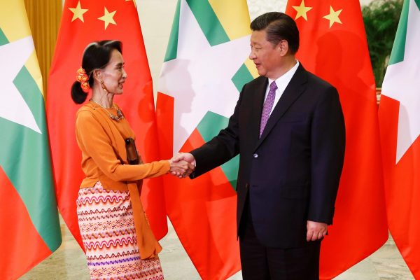 Myanmar State Counsellor Aung San Suu Kyi shakes hands with Chinese President Xi Jinping as they meet at the Great Hall of the People in Beijing, China, 16 May 2017 (Photo: Reuters/Damir Sagolj).
