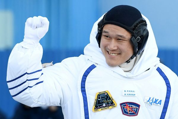 Members of the International Space Station expedition 54/55, Norishige Kanai of the Japan Aerospace Exploration Agency during the send-off ceremony after checking their space suits before the launch of the Soyuz MS-07 spacecraft at the Baikonur cosmodrome, in Kazakhstan, 17 December 2017 (Photo: Reuters/Kirill Kudryavtsev/Pool).