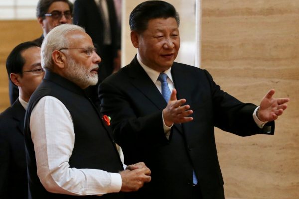 Chinese President Xi Jinping and Indian Prime Minister Narendra Modi talk as they visit the Hubei Provincial Museum in Wuhan, Hubei province, China, 27 April 2018 (Photo: Reuters/China Daily).