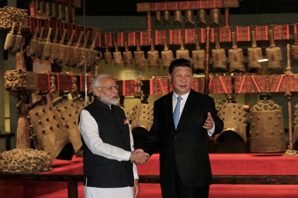 Chinese President Xi Jinping and Indian Prime Minister Narendra Modi shake hands as they visit the Hubei Provincial Museum in Wuhan, Hubei province, China on 27 April 2018. (Photo: Reuters/ China Daily).
