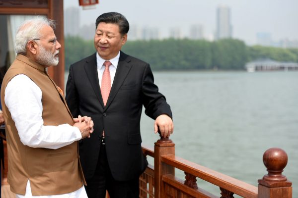Indian Prime Minister Narendra Modi speaks with Chinese President Xi Jinping as they take a boat ride on the East Lake in Wuhan, China, 28 April 2018 (Photo: India's Press Information Bureau via Reuters).