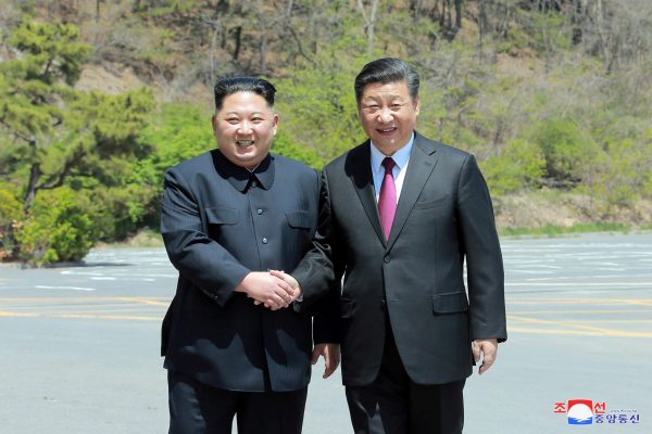 North Korean leader Kim Jong Un shakes hands with China's President Xi Jinping, in Dalian, China in this undated photo released on 9 May 2018 (Photo: Reuters/Korean Central News Agency).