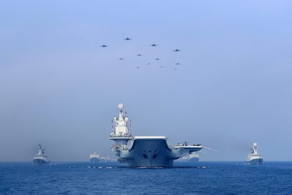Warships and fighter jets of the Chinese People's Liberation Army (PLA) Navy take part in a military display in the South China Sea, 12 April 2018 (Photo: China Stringer Network via Reuters).