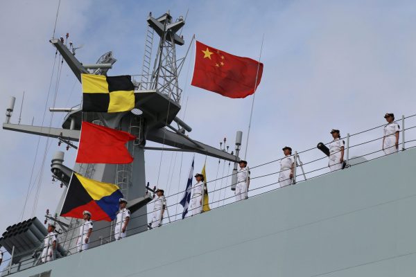 Soldiers of China's People's Liberation Army (PLA) stand on a ship sailing off from a military port in Zhanjiang, Guangdong province, 11 July 2017 (Photo: Reuters/Stringer).