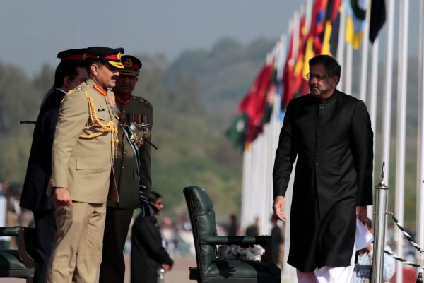 Prime Minister Shahid Khaqan Abbasi is greeted by the heads of armed forces as he arrives at the Pakistan Day military parade in Islamabad, Pakistan, 23 March 2018 (Photo: Reuters/Caren Firouz).