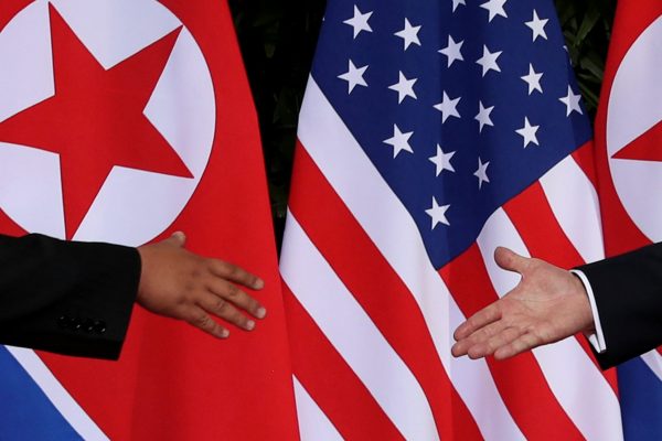 US President Donald Trump and North Korea's leader Kim Jong Un meet at the start of their summit at the Capella Hotel on the resort island of Sentosa, Singapore on 12 June 2018. (Photos: Reuters/Jonathan Ernst).
