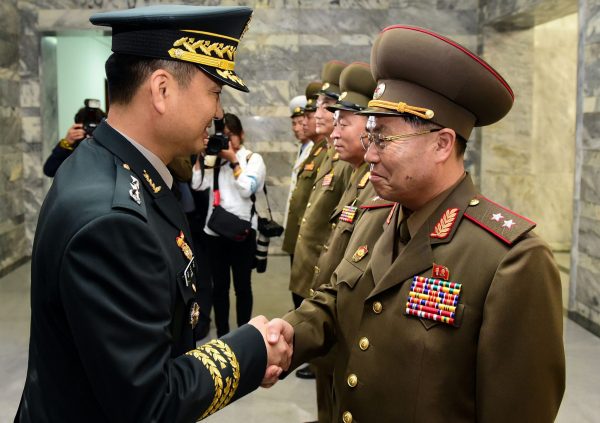 South Korean Major General Kim Do-gyun is greeted by North Korean Lieutenant General An Ik-san before their high-level military talk at the northern side of the truce village of Panmunjom, in North Korea, 14 June 2018 (Photo: Reuters/Yonhap).