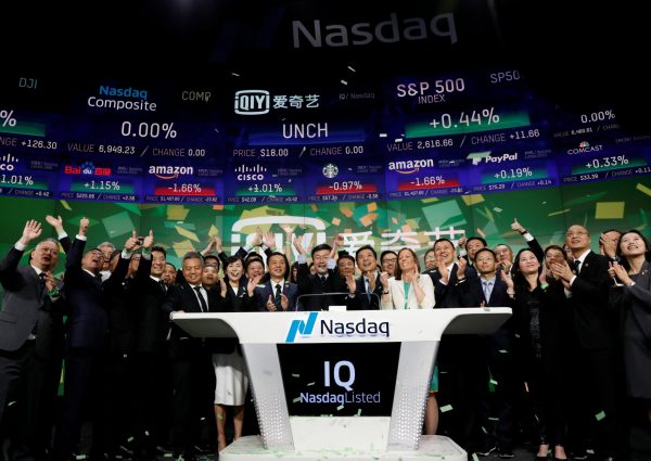 Yu Gong, Founder and CEO of Chinese streaming platform iQiyi Inc, Robin Li, CEO of Baidu and Adena Friedman, president and CEO of Nasdaq ring the opening bell at the Nasdaq Market Site to celebrate iQiyi Inc.'s initial public offering in New York City, United States, 29 March 2018 (Photo: Reuters: Brendan McDermid).