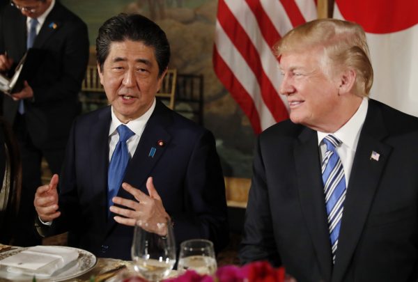 US President Donald Trump looks on as Japan's Prime Minister Shinzo Abe speaks while dining at Trump's Mar-a-Lago estate in Palm Beach, Florida, US, 18 April 2018 (Photo: Reuters/Kevin Lamarque).