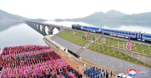 Officials and people take part in ceremony near the railway bridge across Sokjon Bay, part of the Koam-Tapchon railway which was opened to traffic on 30 May 2018 in this photo released by North Korea's Korean Central News Agency in Pyongyang 31 May 2018 (Photo: Reuters/KCNA via Third Party).