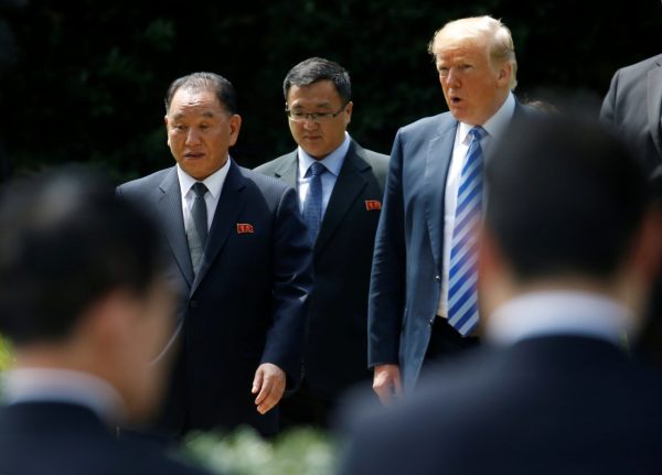 North Korean envoy Kim Yong Chol talks with US President Donald Trump as they walk out of the Oval Office after a meeting at the White House in Washington, US, 1 June 2018 (Photo: Reuters/Leah Millis).