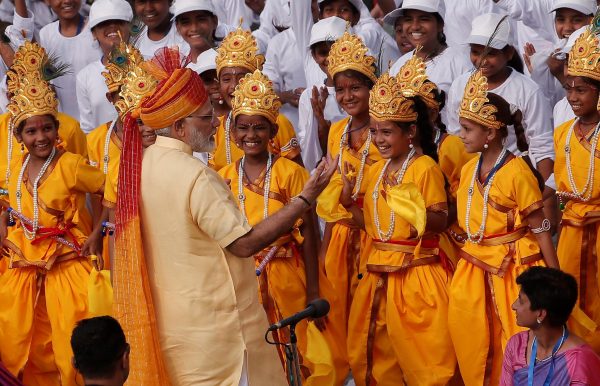 Indian Prime Minister Narendra Modi greets school girls dressed as Hindu Lord Krishna after addressing the nation from the historic Red Fort during Independence Day celebrations in Delhi, India, 15 August 2017 (Photo: Reuters/Adnan Abidi).