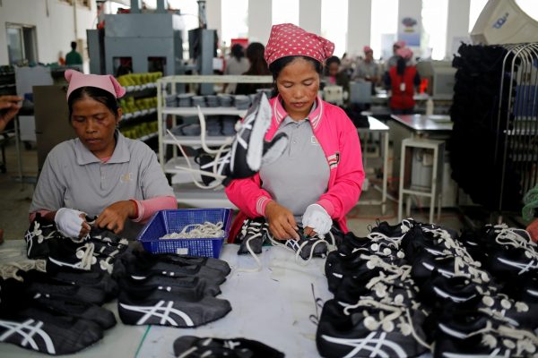 Women work on the production line at Complete Honour Footwear Industrial, a footwear factory owned by a Taiwan company, in Kampong Speu, Cambodia, 5 July 2018 (Photo: Reuters/Ann Wang).