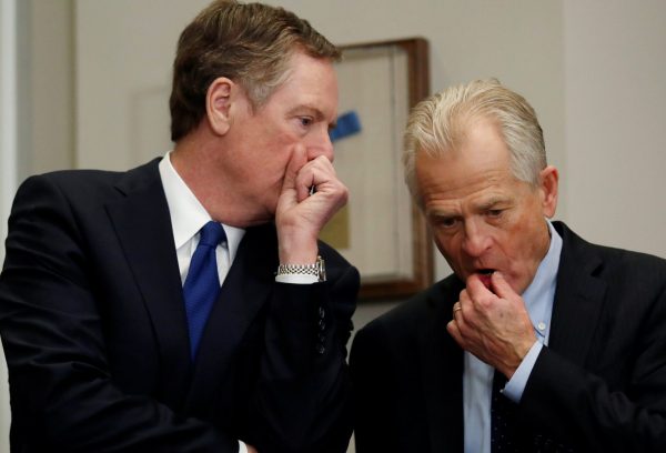 Robert Lighthizer, United States Trade Representative, and Peter Navarro chat while they wait for US President Donald Trump to arrive to make an announcement about new tariffs for steel and aluminum imports at the White House in Washington, US, 8 March 2018 (Photo: Reuters/Leah Millis).