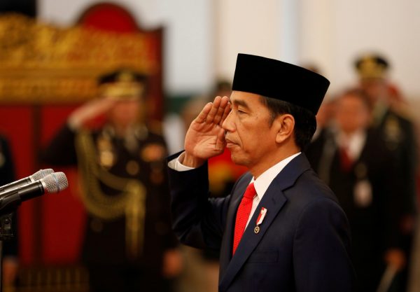 Indonesian President Joko Widodo officiates a swearing in ceremony for new members of his cabinet at the presidential palace in Jakarta, Indonesia, 17 January 2018 (Photo: Reuters/Darren Whiteside).