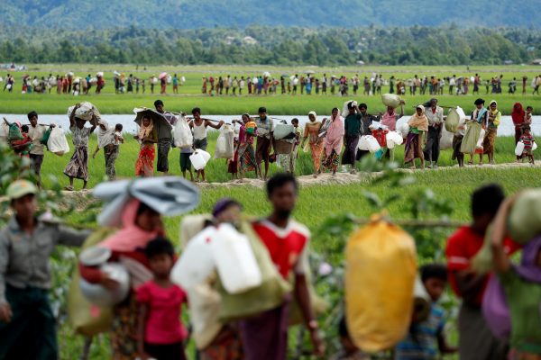 Rohingya refugees, who crossed the border from Myanmar two days before, walk after they received permission from the Bangladeshi army to continue on to the refugee camps, in Palang Khali, near Cox's Bazar, Bangladesh, 19 October 2017 (Photo: Reuters/Jorge Silva).
