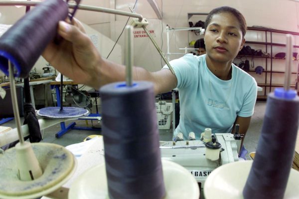 Fijian garment workers make clothing for export in a factory in the capital Suva, 26 July 2000 (Photo: Reuters).