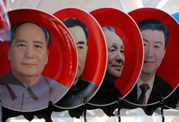 Souvenir plates featuring portraits of current and late Chinese leaders (Right to Left) Xi Jinping, Deng Xiaoping, Zhou Enlai and Mao Zedong are displayed for sale at a shop next to Tiananmen Square in Beijing, China, 1 March 2018 (Photo: Reuters/Jason Lee).