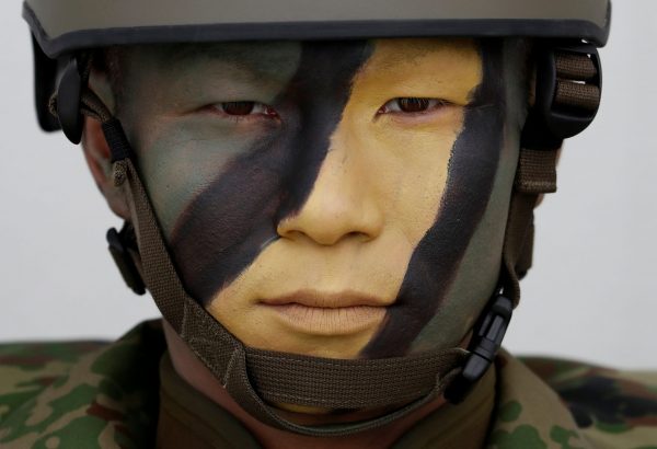 A soldier of Japanese Ground Self-Defense Force (JGSDF)'s Amphibious Rapid Deployment Brigade (ARDB), Japan's first marine unit since World War Two, is seen at JGSDF's Camp Ainoura in Sasebo, on the southwest island of Kyushu, Japan, 7 April 2018 (Photo: Reuters/Issei Kato).