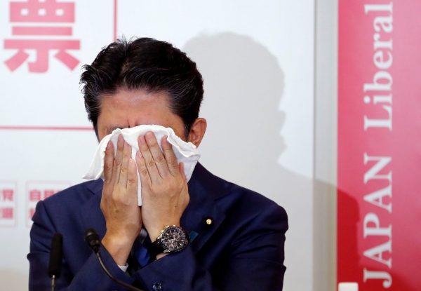 Japan's Prime Minister and ruling Liberal Democratic Party leader Shinzo Abe reacts at a joint news conference with ex-defence minister Shigeru Ishiba for the party leader election at their headquarters in Tokyo, Japan, 10 September 2018 (Photo: Reuters/Toru Hanai).