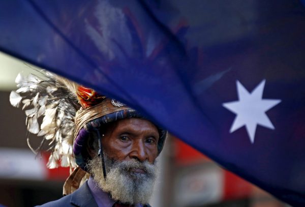 A veteran from Papua New Guinea wears a traditional head dress as he marches during the ANZAC (Australian and New Zealand Army Corp) Day march through central Sydney, Australia, 25 April 2016 (Photo: Reuters/David Gray).