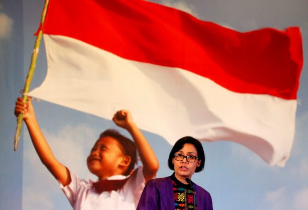 Indonesian Finance Minister Sri Mulyani Indrawati speaking in front of a backdrop of a flag-carrying child at the Finance Ministry in Jakarta. ‘Upgrading human capital’ is one area on which Indonesia must focus to achieve its growth potential (Picture: Beawiharta/Reuters).