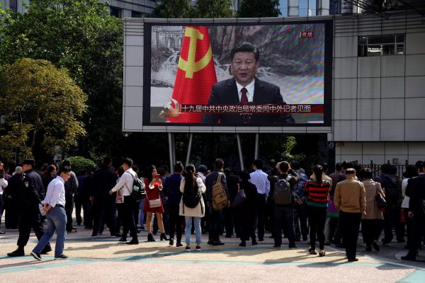 News from the top: passers-by in Shanghai watch a live public broadcast of President Xi Jinping introducing his Politburo Standing Committee in October 2017 (Photo: Reuters/Aly Song).