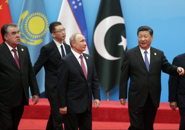 Russian President Vladimir Putin, President of the People’s Republic of China Xi Jinping and President of the Republic of Tajikistan Emomali Rahmon are seen during a photo session of the Shanghai Cooperation Organisation in Qingdao, China, 10 June, 2018 (Photo: Reuters/Sputnik).