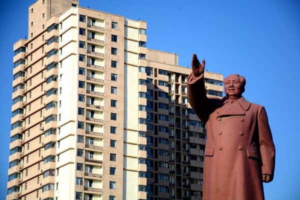 A statue of former Chinese Chairman Mao Zedong is seen in front of a residential building in Dandong New Zone, Liaoning province, China, 12 June 2018 (Photo: Reuters/Stringer).