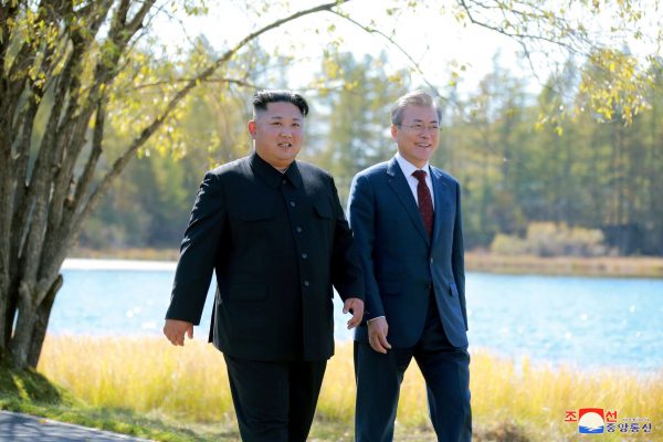 Moon Jae-in and Kim Jong Un walk during a luncheon, in this photo released by North Korea's Korean Central News Agency (KCNA) in Pyongyang, North Korea, 21 September 2018, (Photo: KCNA/Reuters)