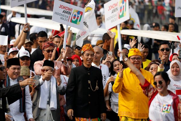 Indonesian President Joko Widodo and his running mate Ma'ruf Amin, walk in a parade at a ceremony marking the start of the campaigning period for next year's presidential election in Jakarta, Indonesia, 23 September 2018 (Photo: Reuters/Darren Whiteside).