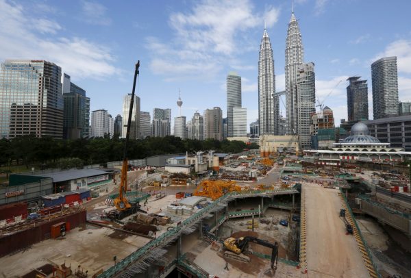 A view of a building site beneath the Petronas Towers in Kuala Lumpur, Malaysia, 18 February 2016 (Photo: Reuters/Olivia Harris).